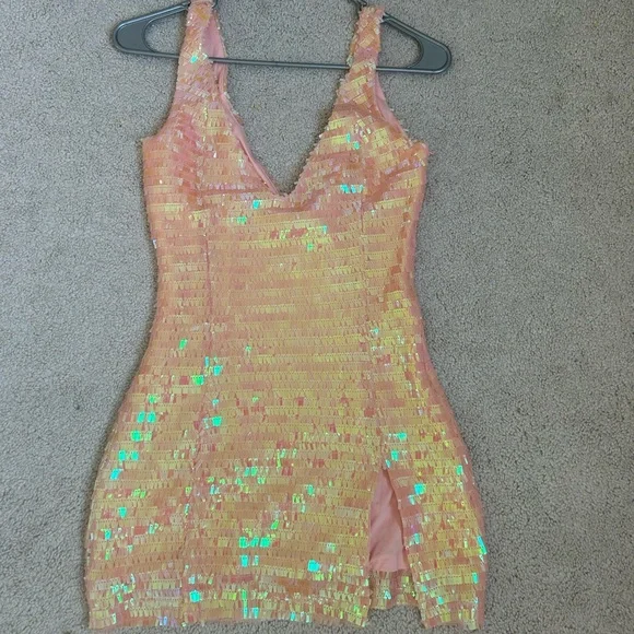 This dress is from SorelleUK! It is a size xs and in the color Peachy. - Picture 2 of 4